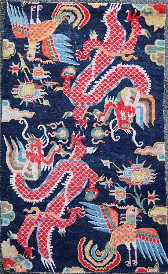 A Tibetan dragon rug, 5ft 6in. x 3ft